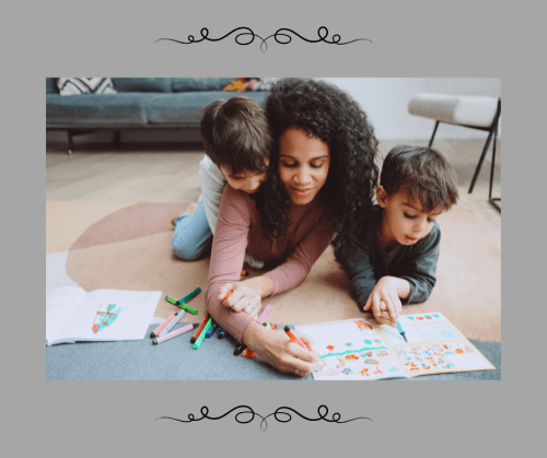 Mother and two kids coloring on the floor of their home.