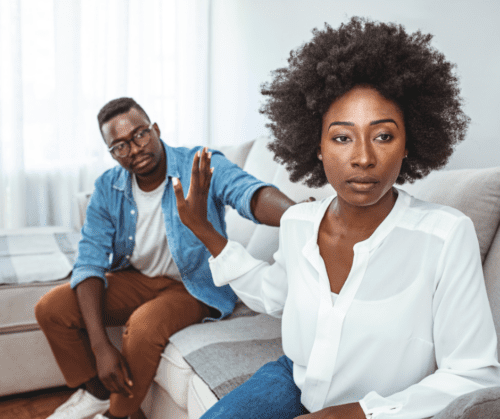 Young black couple having a fight on a couch