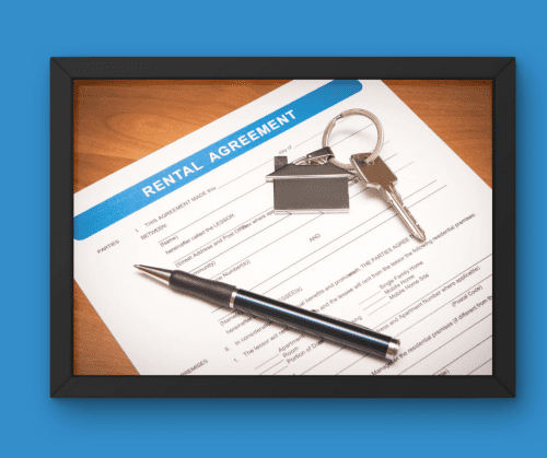 Rental lease agreement with keys and a pen