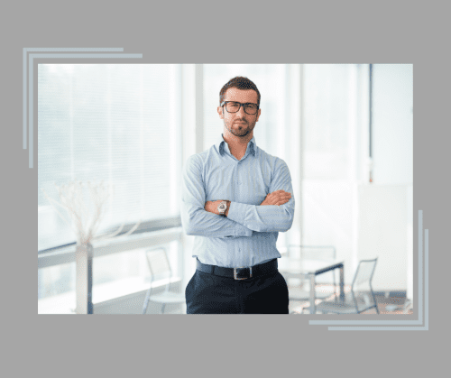 Images of a confident male divorce coach in business casual clothing standing in front of a window. 